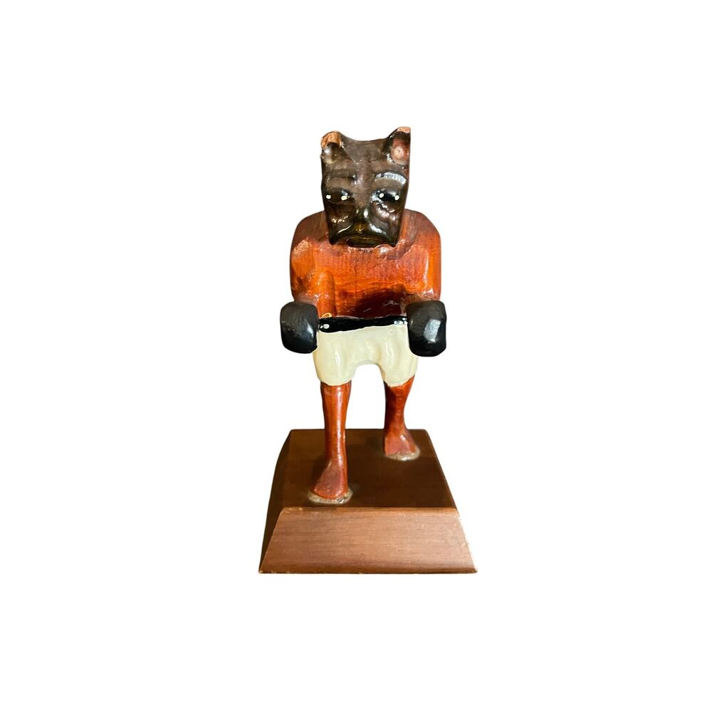 Vintage hand carved wooden 6” boxing dog figure with white shorts.